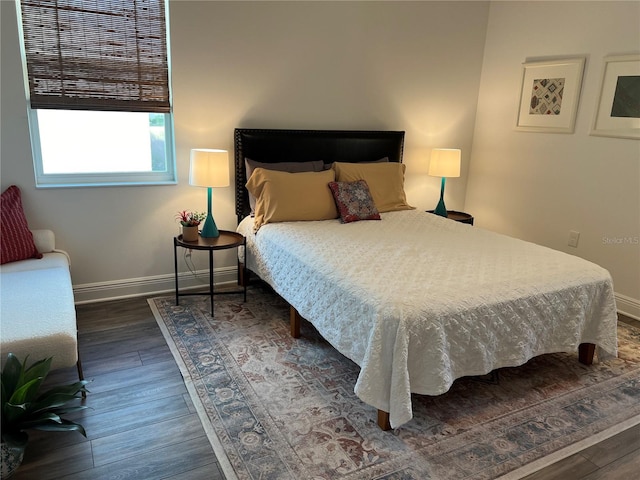 bedroom featuring dark hardwood / wood-style flooring