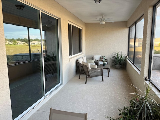 sunroom / solarium with ceiling fan