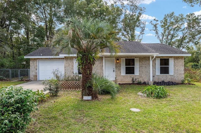 ranch-style house with a garage and a front lawn