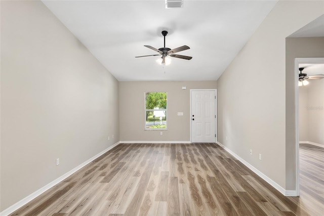 spare room featuring ceiling fan and light hardwood / wood-style floors