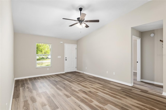 empty room with hardwood / wood-style flooring and ceiling fan