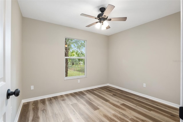 unfurnished room featuring hardwood / wood-style floors and ceiling fan