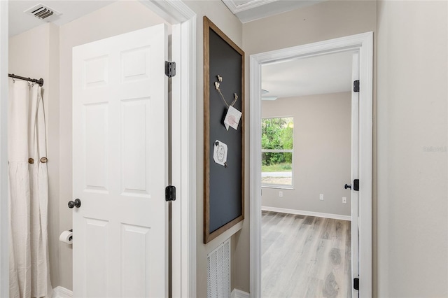 hallway with light wood-type flooring