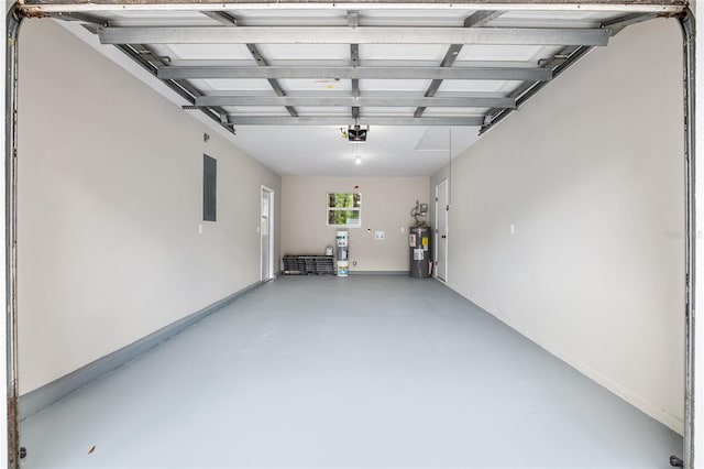 garage featuring electric panel, water heater, and a garage door opener