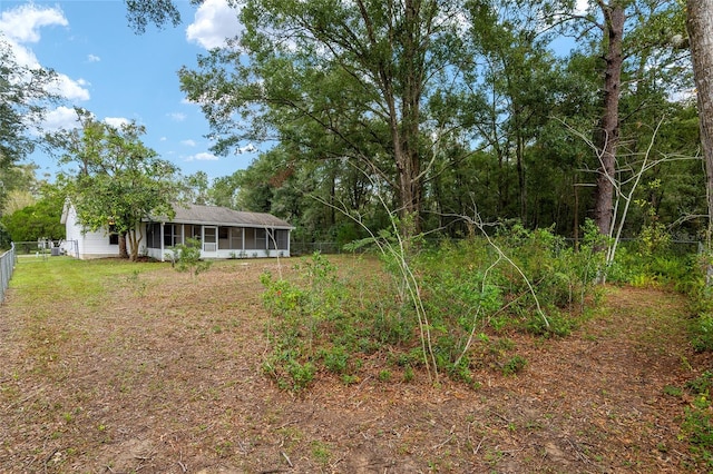 view of yard with a sunroom