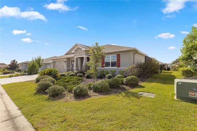 view of front of home featuring a garage and a front yard