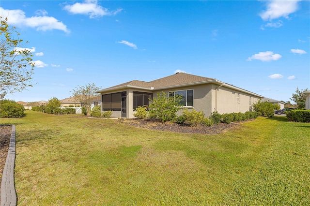 view of property exterior featuring a lawn and a sunroom