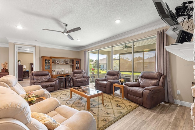 living room with ornamental molding, a textured ceiling, ceiling fan, and light hardwood / wood-style flooring