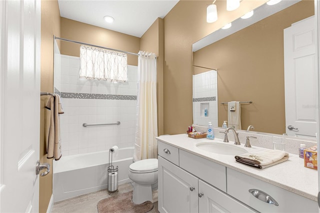 full bathroom featuring vanity, shower / bath combo with shower curtain, and toilet