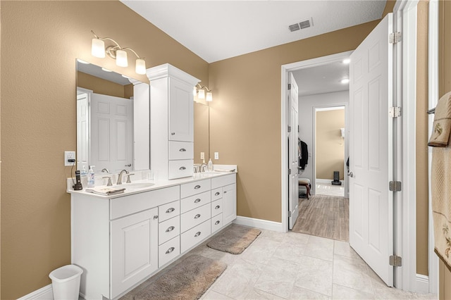 bathroom featuring vanity and tile patterned flooring