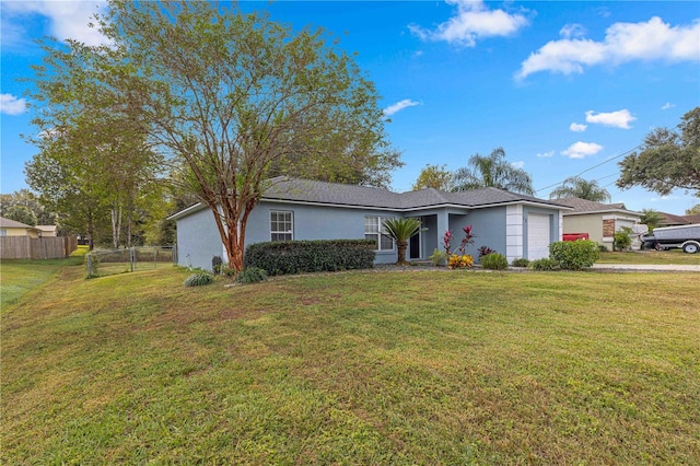 ranch-style house with a garage and a front lawn