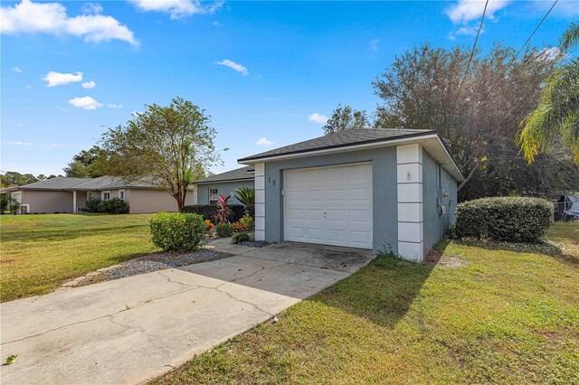 garage with a lawn