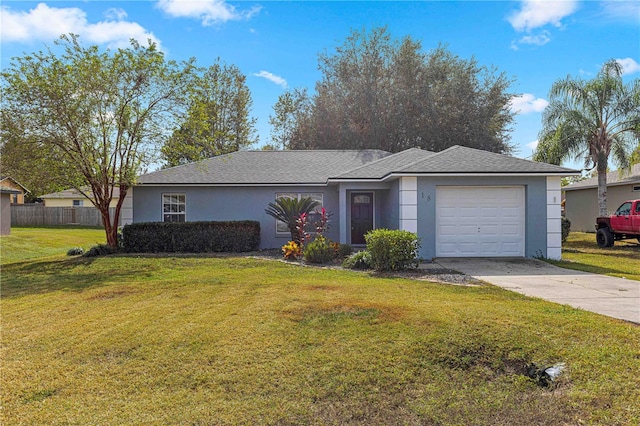 ranch-style house with a garage and a front yard