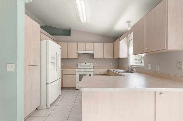 kitchen featuring light brown cabinetry, kitchen peninsula, white appliances, and lofted ceiling