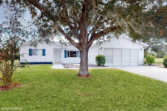 single story home with a front lawn and a garage