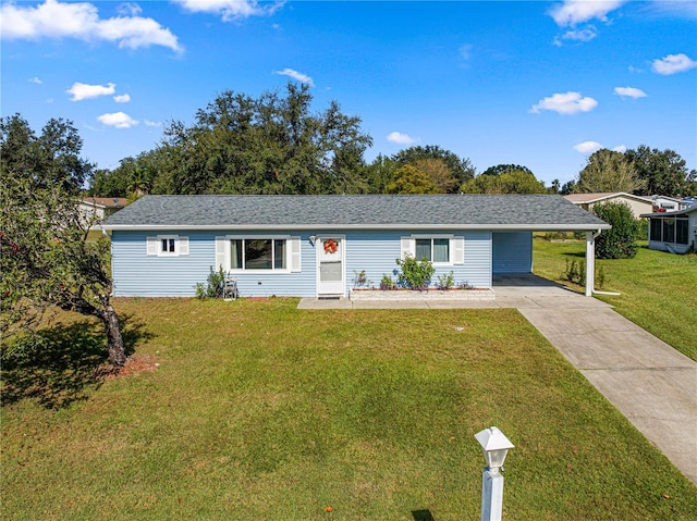 ranch-style home with a front yard and a carport