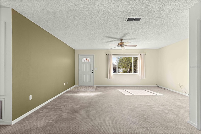 interior space featuring a textured ceiling and ceiling fan