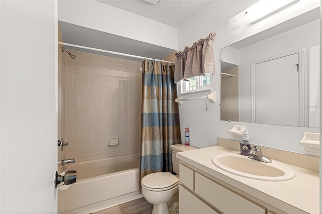 full bathroom with vanity, a textured ceiling, shower / bath combo, hardwood / wood-style floors, and toilet