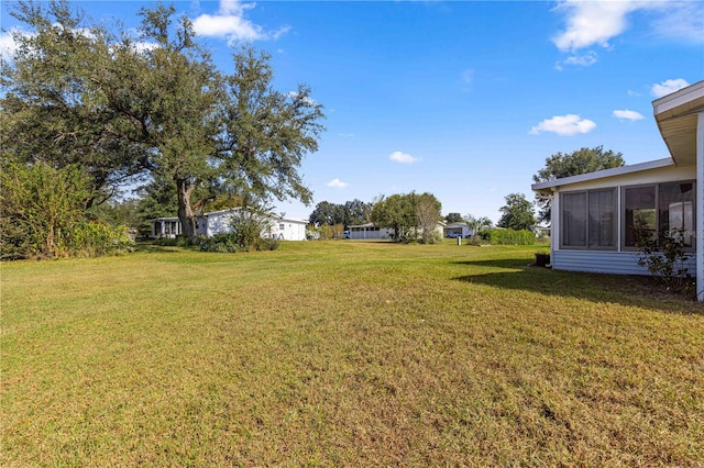 view of yard with a sunroom