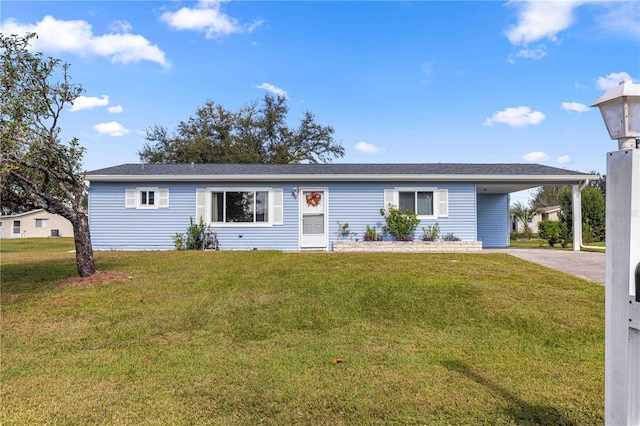 ranch-style home featuring a carport and a front yard