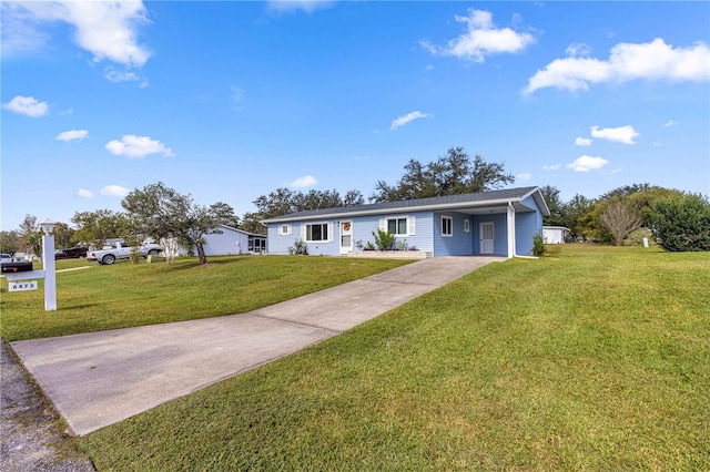 ranch-style home featuring a carport and a front lawn