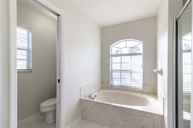 bathroom with tile patterned floors, toilet, and independent shower and bath