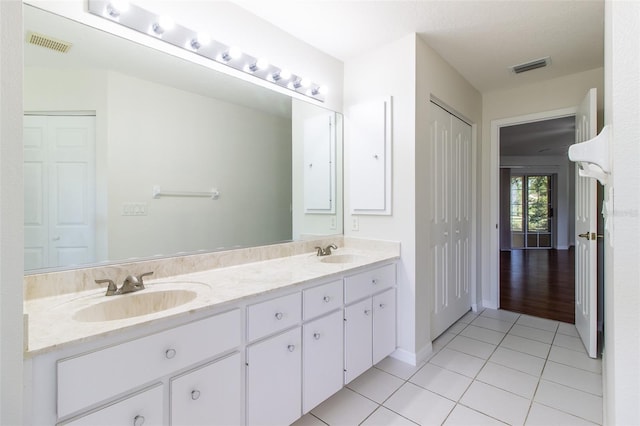 bathroom featuring tile patterned floors and vanity