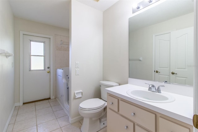 bathroom with tile patterned floors, vanity, and toilet