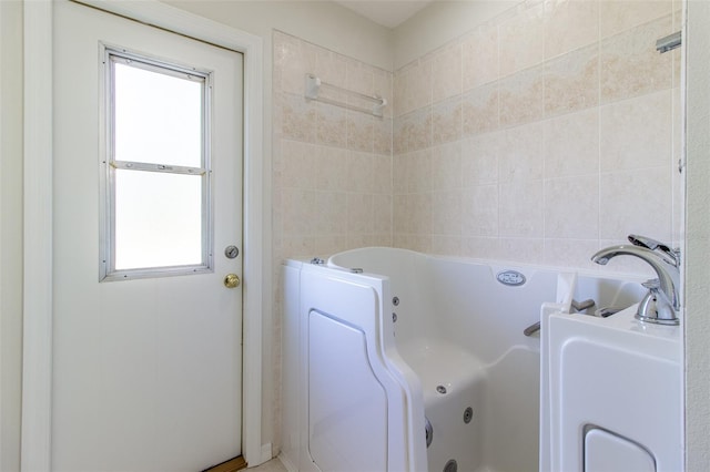 bathroom featuring a tub