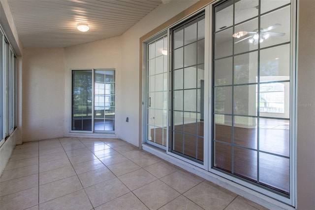 interior space with ceiling fan and wood ceiling