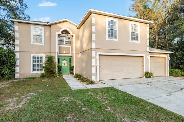 view of front of property with a front yard and a garage