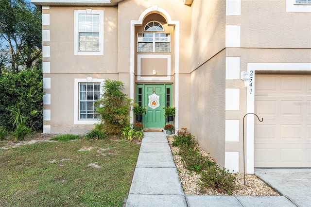 view of exterior entry featuring a garage