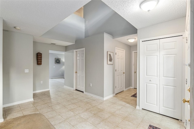 spare room with a textured ceiling