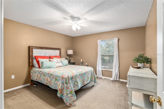 bedroom with carpet, a textured ceiling, and ceiling fan