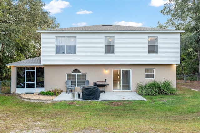 back of property featuring a yard and a patio