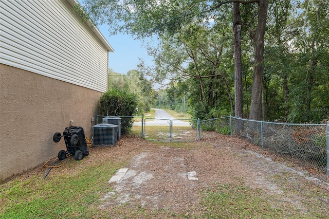 view of yard featuring central AC unit