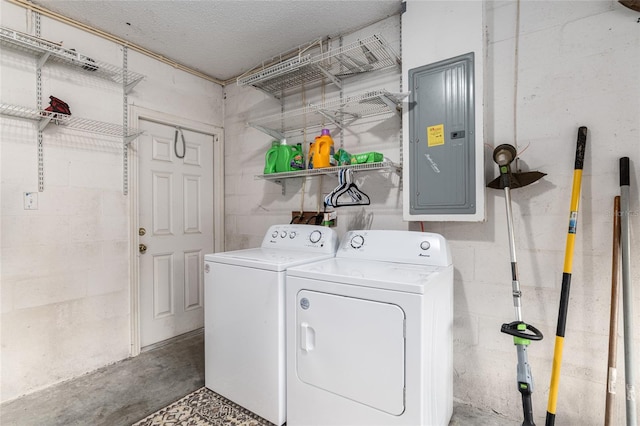 clothes washing area featuring washer and dryer and electric panel