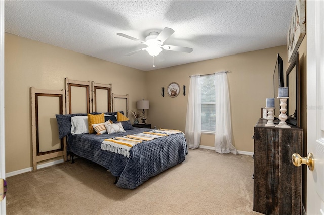 bedroom with light carpet, a textured ceiling, and ceiling fan