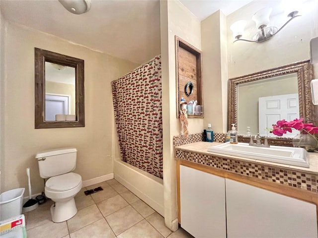 full bathroom featuring tile patterned flooring, shower / bath combination with curtain, vanity, and toilet