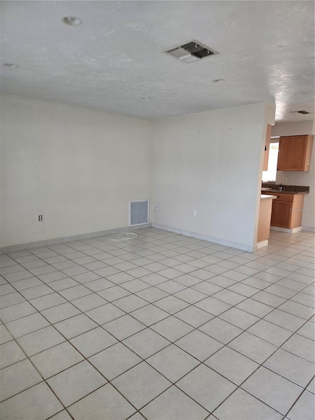 unfurnished living room featuring a textured ceiling