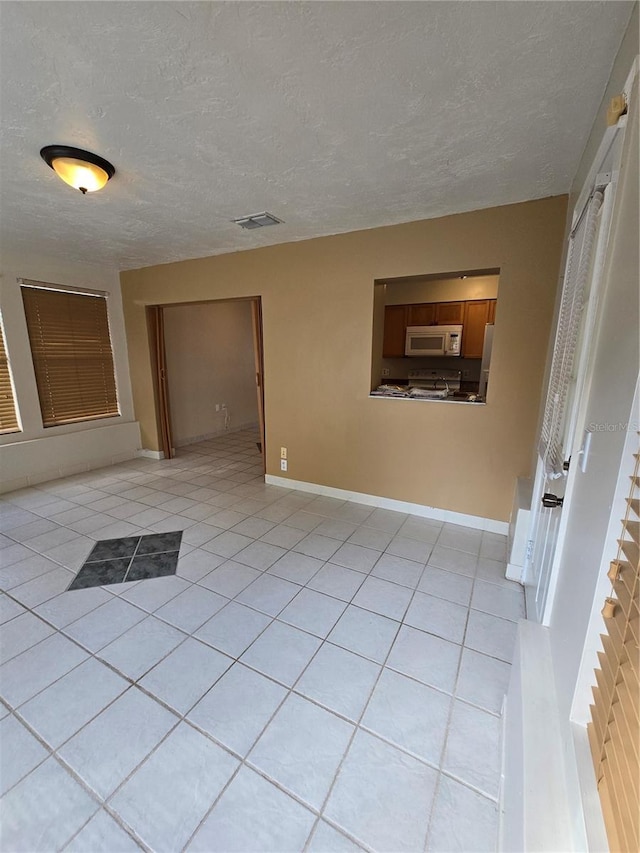 interior space with a textured ceiling