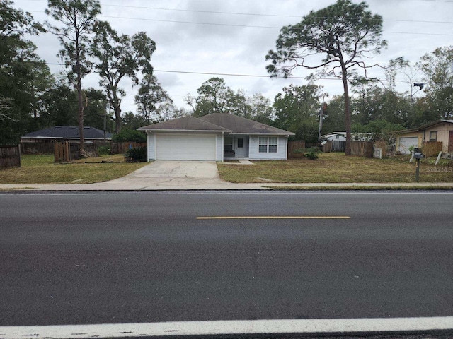 ranch-style house with a front lawn and a garage