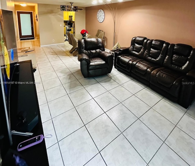 living room with tile patterned floors and ceiling fan