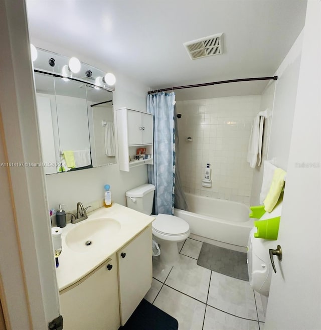 full bathroom featuring tile patterned floors, vanity, toilet, and shower / bath combo with shower curtain