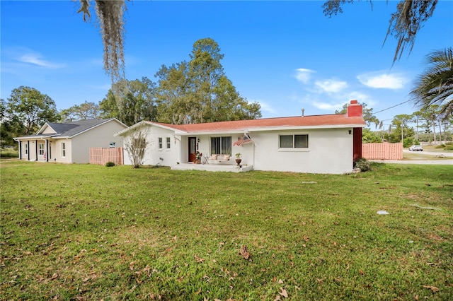 single story home featuring a front yard