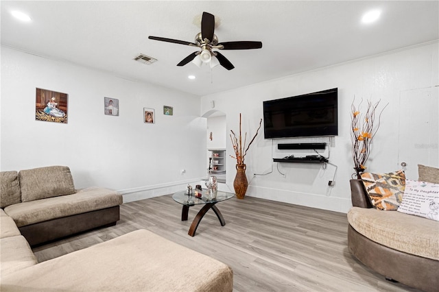 living room with ceiling fan and wood-type flooring