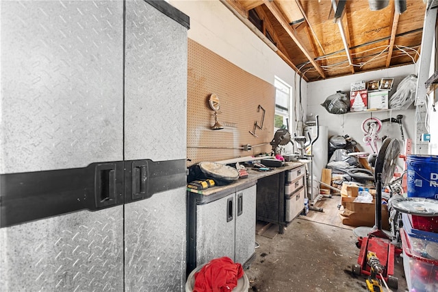 interior space with a workshop area and concrete floors