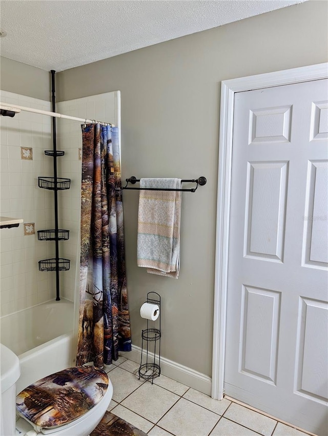 bathroom with tile patterned flooring, shower / bathtub combination with curtain, a textured ceiling, and toilet