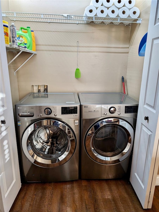 washroom featuring washer and dryer and dark hardwood / wood-style flooring