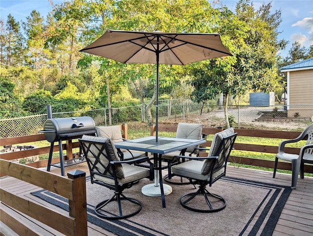 wooden terrace featuring area for grilling